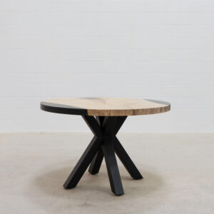 hand-crafted wooden dining room table with black metal legs.