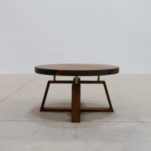 Side image of the juniper coffee table, made of black walnut wood, with the illusion of a floating table top.