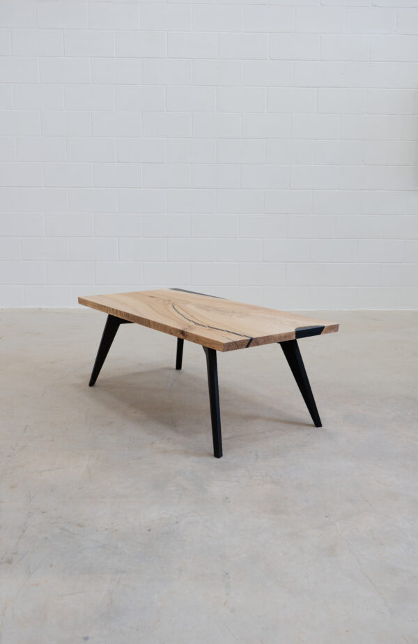 form coffee table made of ash wood with minimalist design.