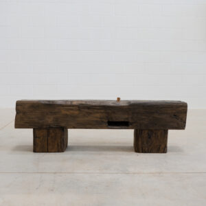 rustic looking chocolate colour wooden beam bench.