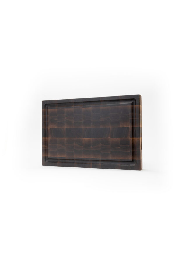 a high quality kitchen cutting board made out of the ends of black walnut wood, making a checker pattern.