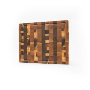 a large kitchen cutting board made up of many different end pieces of wood, creating a beautifully chaotic pattern.