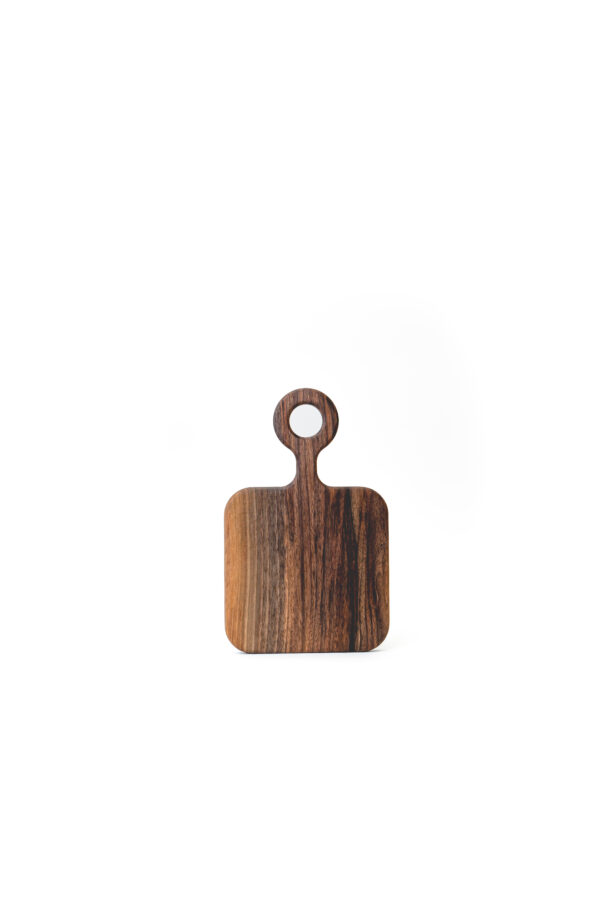 small wooden serving board with integrated handle.
